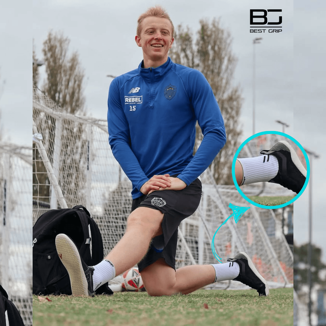 Person in sports attire on a soccer field wearing best grip socks nz