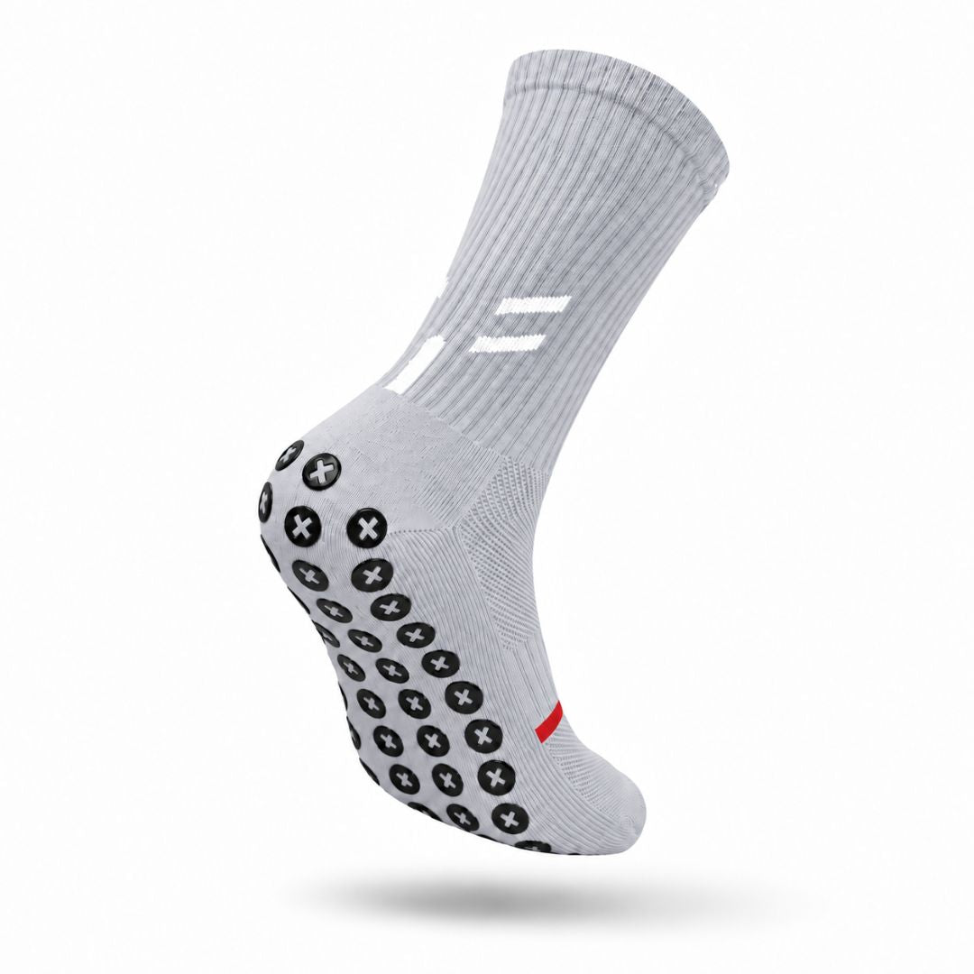 Grey Best Grip grippy socks for footballers and athletes in NZ and Australia, featuring black XCORE Grip™ pads for traction, sweat-wicking, quick-drying fabric for comfort and white detailing.