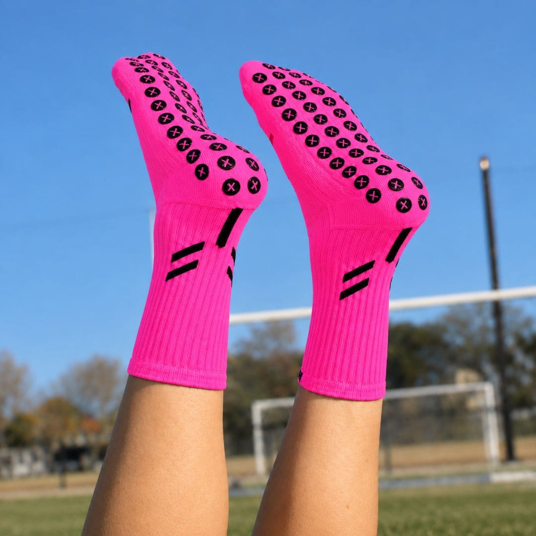 Bright pink Best Grip performance grip sock highlighting superior non-slip grip, fitted cuff, lightweight compression, breathable mesh, blister protection, reinforced heel and toe, and XCORE™ grip pads for football, rugby, netball, Pilates and all sports in New Zealand.