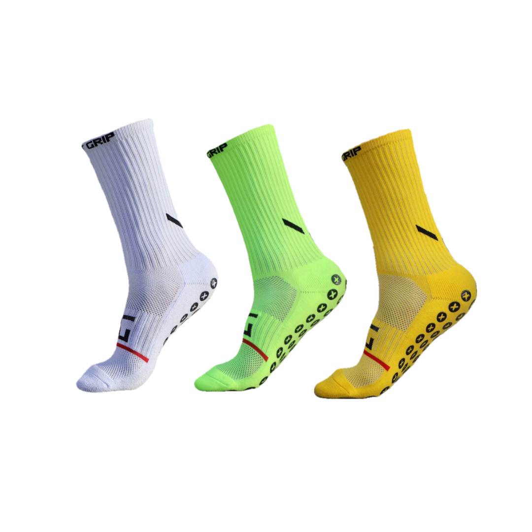 Three sports socks in a 3-pack bundle, featuring aXcore grip pattern on the sole. Colors of the socks are white, green, and yellow, each with black design elements.